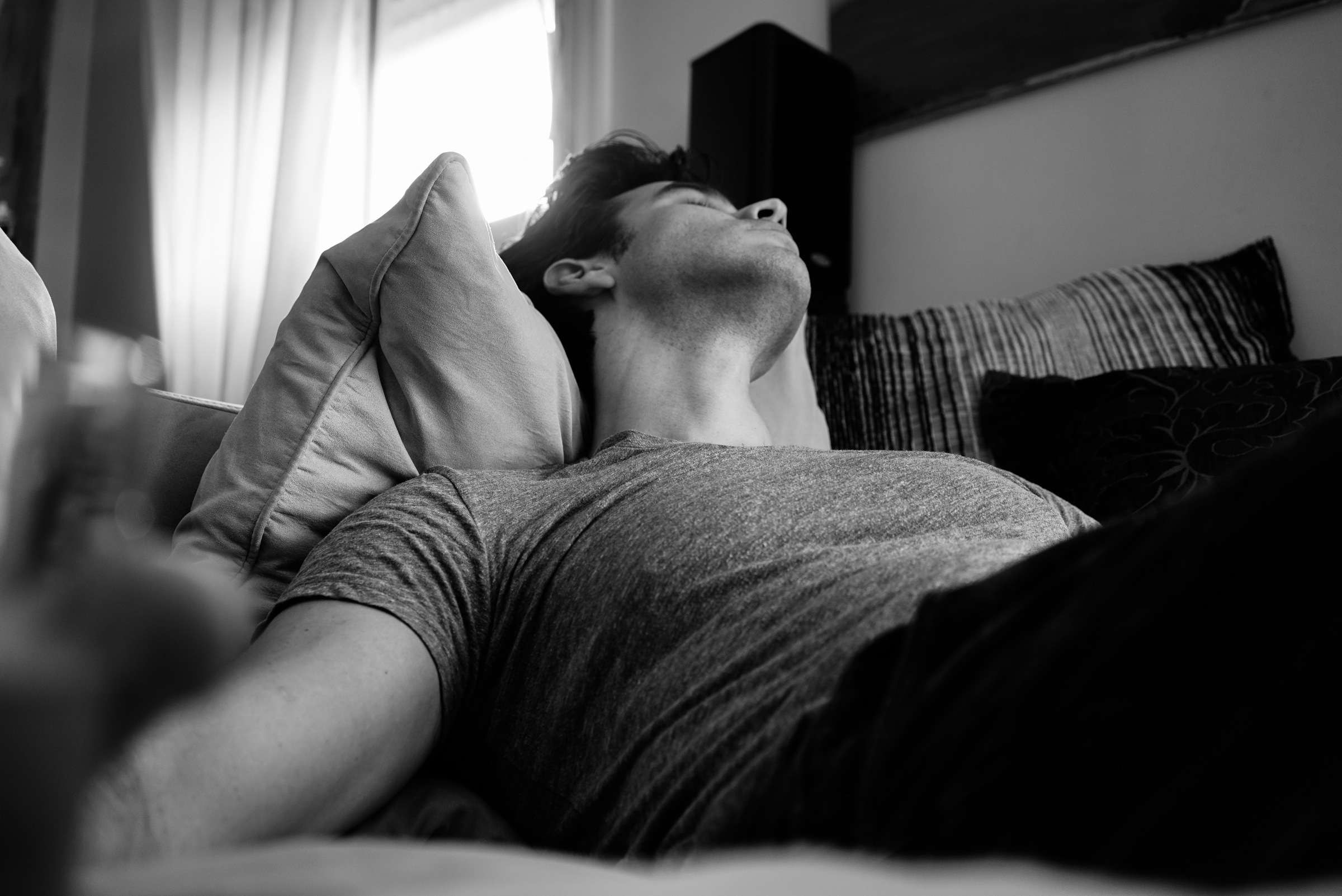 man sleeping in his bedroom