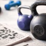 fitness items for swinging crossword clue